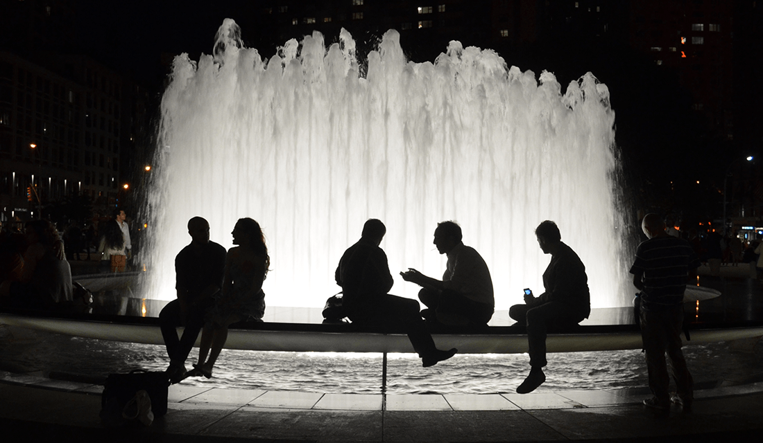 People Sitting by Fountain