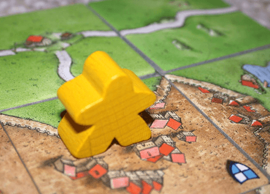 The classic Carcassonne "meeple" (Source: Klo~enwiki/Wikimedia Commons)