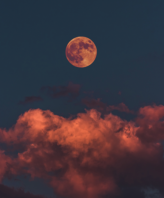 Red Full Moon Over Clouds